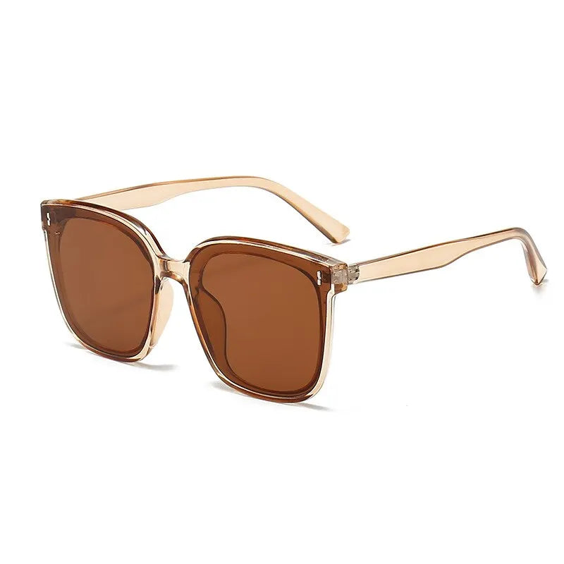 Lunettes de soleil carré oversize marron transparent femme tendances 2025